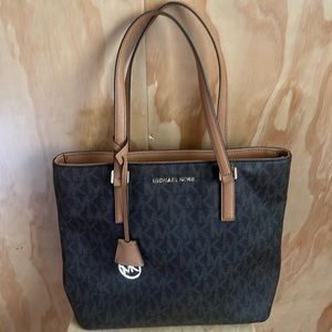 Micheal Kors signature bag in brown and tan. Like new!